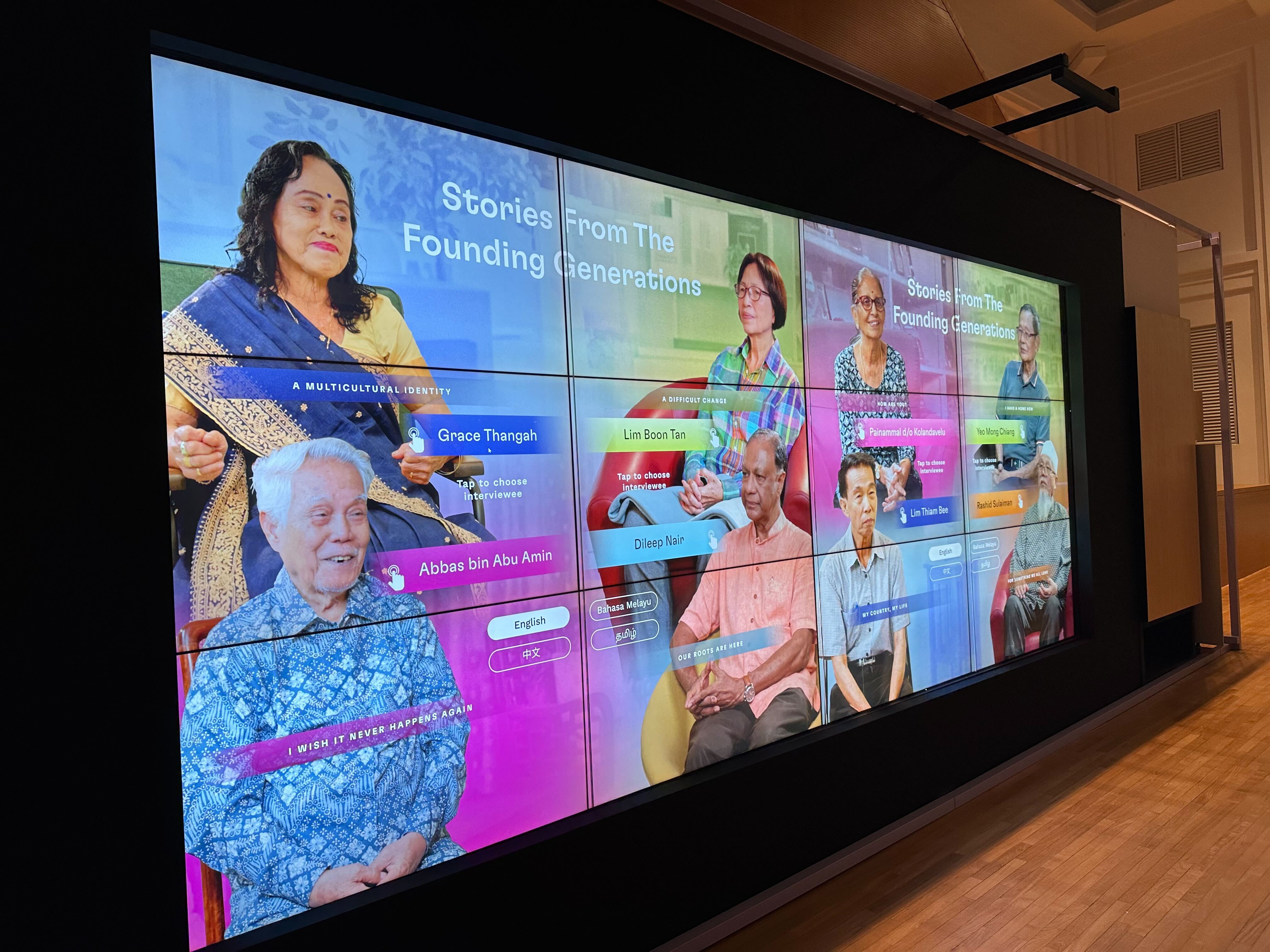 Project Citizens video wall featuring Stories From The Founding Generations - multilingual interviews with elderly Singaporeans sharing their multicultural identities.
